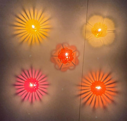 TrifleArte Pack of 12 Assorted 3D Floating Diyas – Swastik, OM, Star, Sun, Flower – Reusable & Colourful Oil Lamps